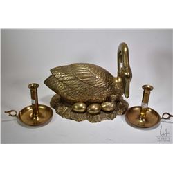 Large brass swan 11 1/2" high and 14" wide plus a pair of brass candlesticks