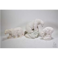 Three solid cast polar bear figures including large 9 1/2" cast United Design Classic Critters bear 