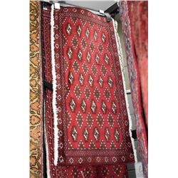 100% handmade Iranian wool runner carpet with fringed edges, geometric design in shades of deep red,