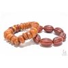 Image 1 : Two bracelets including bees wax and an agate bracelet
