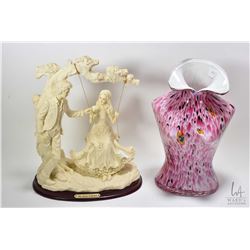 Resin lovestory sculpture from the Natelia Collectible and a mottled glass female torso vase 12" in 