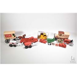 Selection of reproduction die cast vintage style toys including tractors, trucks, delivery truck, fi