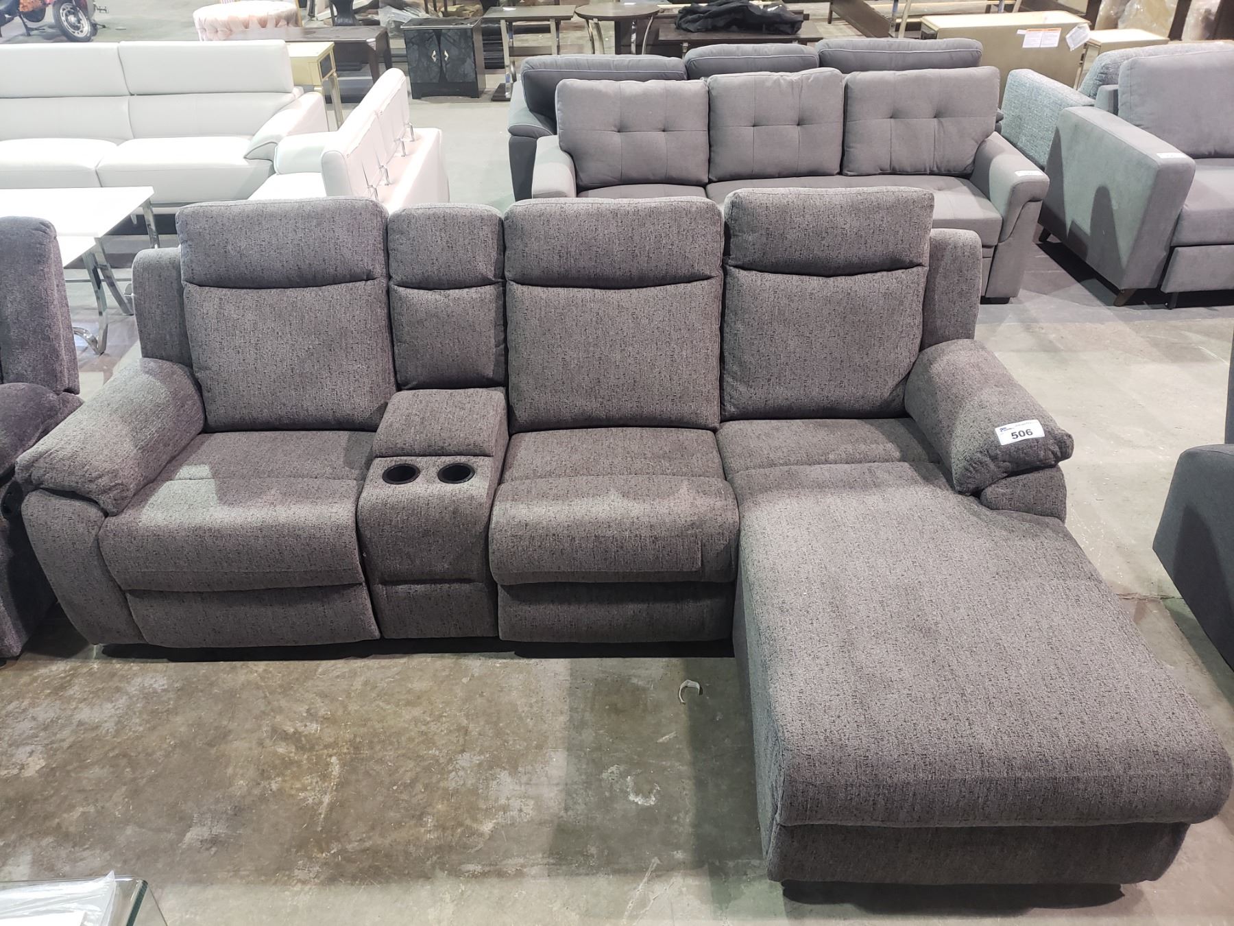 GREY RECLINING SOFA WITH CENTER STORAGE COMPARTMENT & CUP HOLDERS Able Auctions GREY RECLINING SOFA WITH CENTER STORAGE COMPARTMENT & CUP HOLDERS Able Auctions