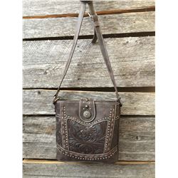 MONTANA WEST LEATHER TOOLED MESSENGER BAG/Top zipper closure. Inside of bag has a zippered pocket wi