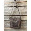 Image 1 : MONTANA WEST LEATHER TOOLED MESSENGER BAG/Top zipper closure. Inside of bag has a zippered pocket wi