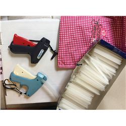 TWO PRICE TAGGING GUNS AND BOX OF PLASTIC HOLDERS