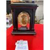 Image 1 : Black framed open face clock 11" high good working condition