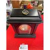 Image 2 : Black framed open face clock 11" high good working condition