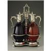 Image 2 : A Silver Plate and Colored Glass Decanter SetAme A Silver Plate and Colored Glass Decanter Set
