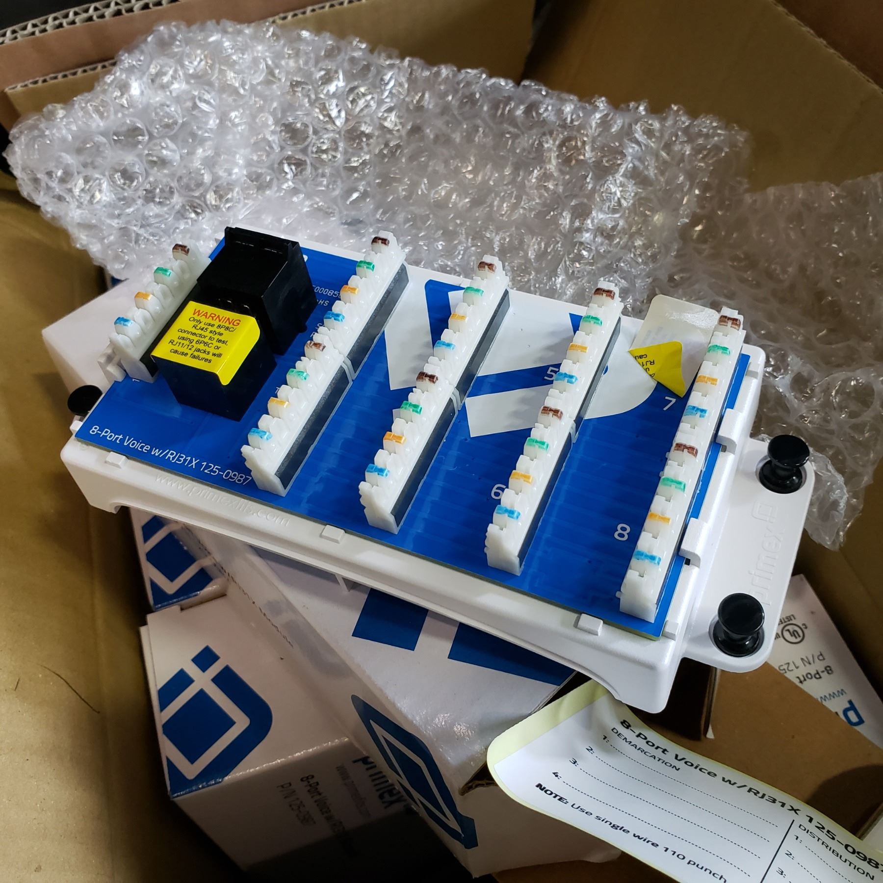 BOX OF PRIMEX 8 PORT VOICE MODULES