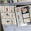 Image 2 : 5 BINDERS OF PIN-UP GIRLS SWIMSUIT AND MERMAIDS, AND MERMAID TRADING CARDS