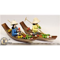 LADIES IN WOODEN CANOE BOATS