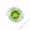 Image 1 : Vintage Platinum 10.20 ctw Round Peridot and Marquise Diamond Ring
