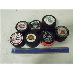 13 Hockey Pucks