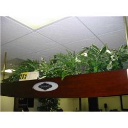 grouping of silk ferns top of pool tabl