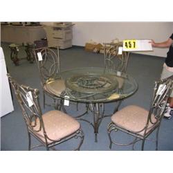 Wrought and glass dining table with 4 c
