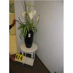 silk lillies in damaged vase with table