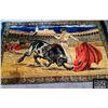 Image 1 : VINTAGE BULL AND MATADOR WALL TAPESTRY. MEASURES 75” X 45”. HAS FRINGES ON SHORT SIDES.