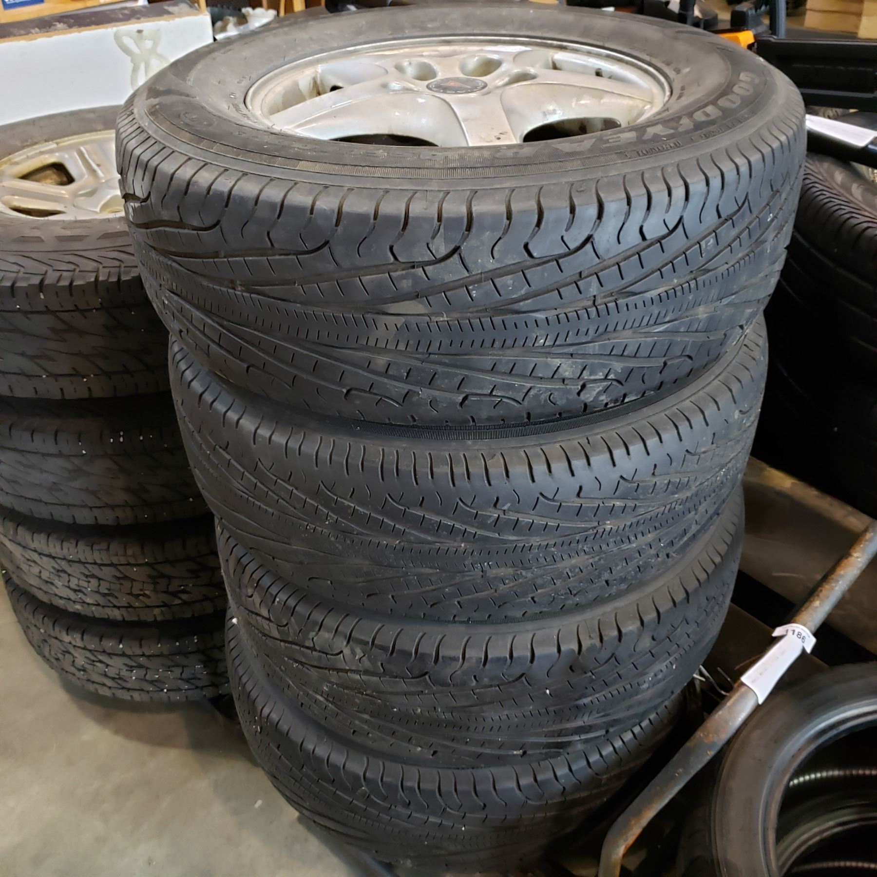 SET OF 4 P215/70 R15 TIRES ON 5 BOLT PONTIAC RIMS