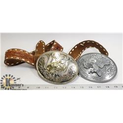 A PAIR OF OVERSIZED WESTERN THEMED BELT BUCKLES