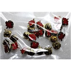 5)  LOT OF 27 GOLD TONE AND RED ENAMEL MAPLE LEAF