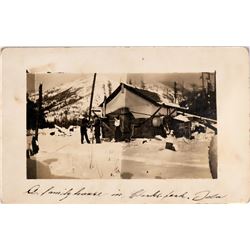 Clarks Fork, Idaho, Real Photo Postcard: Winter image of a homestead in Mountains  (119953)