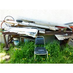 PILE OF SCRAP STEEL & WOOD FROM WELDING TABLE TO THE DOOR