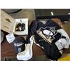 Image 1 : OFICIALLY LICENSED PITTSBURGH PENGUINS REEBOK NHL JERSEY AND STARHANGER AND CASE OF 10 FLASHING PINS