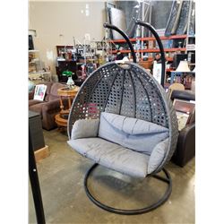 FLOOR MODEL MODERN RATTAN OUTDOOR DOUBLE HANGING CHAIR W/ CHARCOAL CUSHIONS - RETAIL $1799 AND RATED