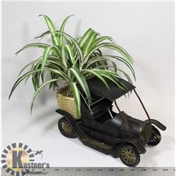 ANTIQUE TRUCK WITH PLANT IN WICKER BASKET IN