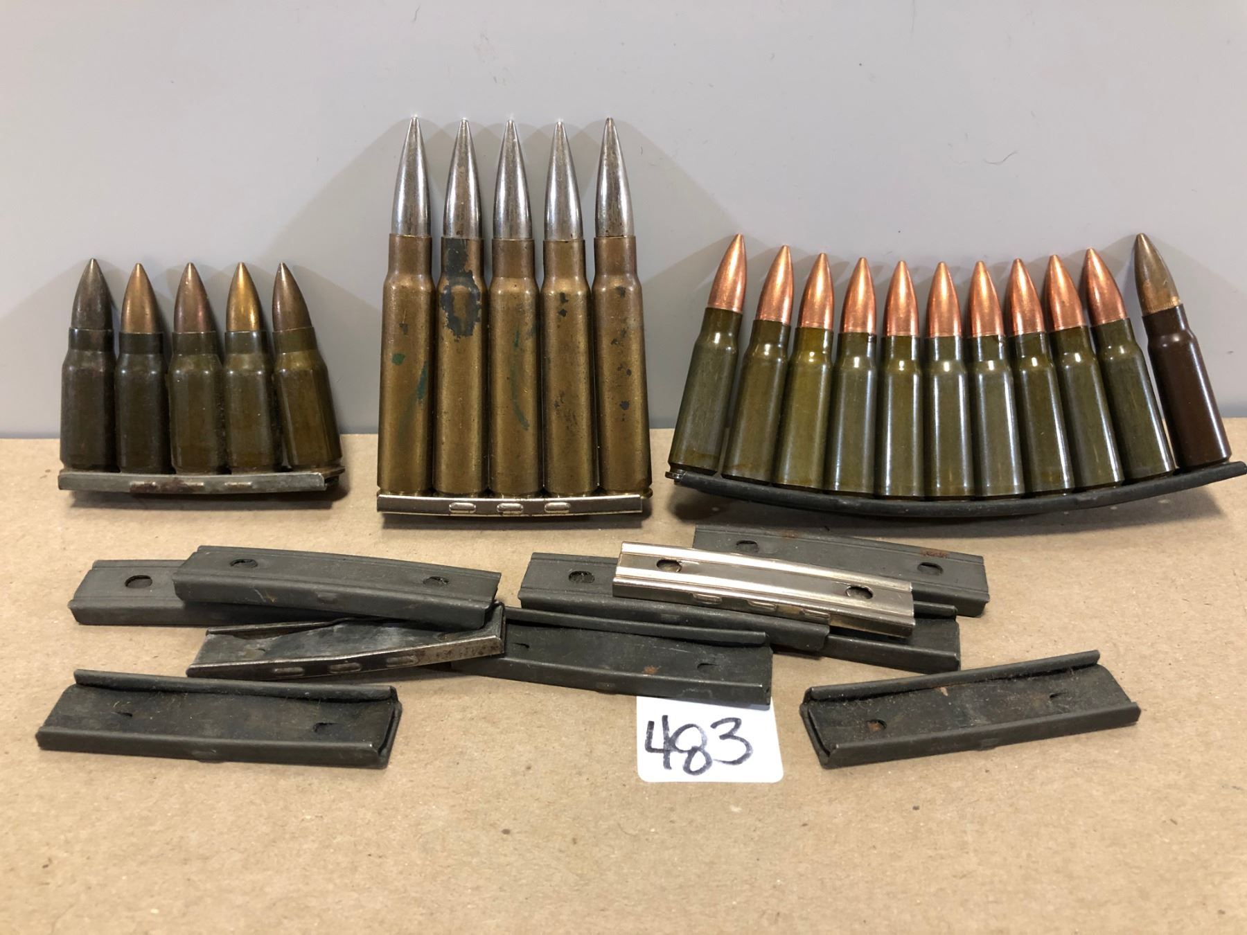 AMMO: 21 X UNKNOWN CAL W/ QTY OF CLIPS - Kidd Family Auctions