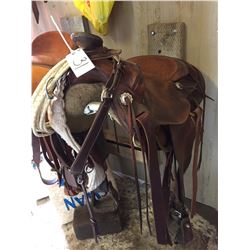 Western Rawhide Roper adult saddle comes with breast plate, and lariat,