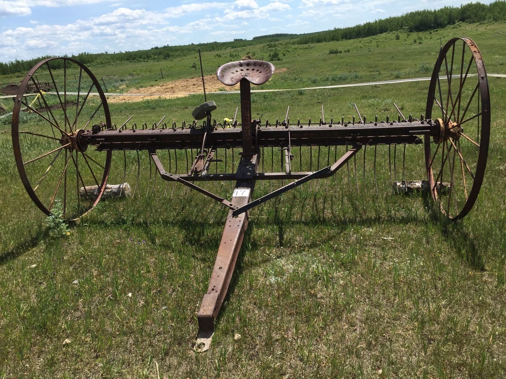 Horse drawn dump rake