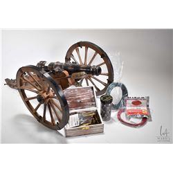 Miniature .69 caliber Spanish cannon. 26 1/2" with wooden carriage. Includes selection of cannon bal