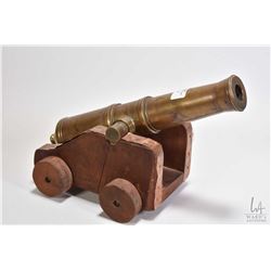 Miniature brass 10 3/4" cannon stamped Levesque on wooden cart