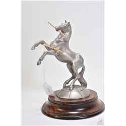 Limited edition Colt Firearms pewter "Rampant Colt" figure circa 1982 on wooden base, 6 3/4" in heig