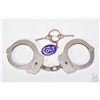 Image 1 : Pair of vintage genuine Colt Firearms handcuffs, serial no. 008194 with two keys and a Colt keychain