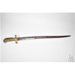 Unknown antique saber bayonet with brass handle and rusted blade