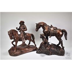 Two Austin Production cowboy themed sculptures, plaster with bronze style finish, both slightly dama