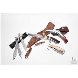 Selection of collectible knives including hunting knife in leather sheath, set of throwing knives, t