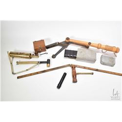 Vintage wood and metal clay pigeon thrower, military style gun cleaning kits, folding tape measures,