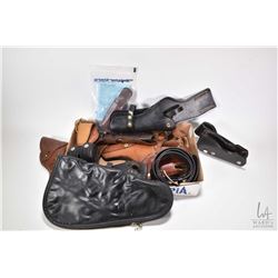 Selection of leather holsters, pouches and belts plus a Browning handgun bag