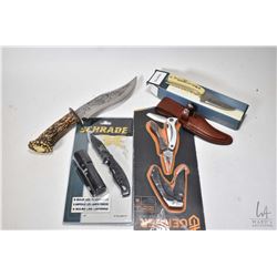 Selection of new in package knives including Schrade knife with sheath, a Schrade folding knife with