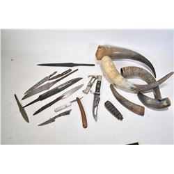 Green metal drawer with a selection of horns, knives, blades and handles