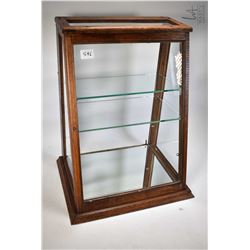 Antique oak wedge shaped showcase/retail display cabinet with glazed top, sides and front with two g