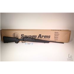 Non-Restricted rifle Savage Arms model Axis, .22-250 Rem bolt action, w/ bbl length 22" [Satin black