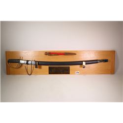 Wall mounted "The Pen is Mightier Than The Sword" display including a 37" sword in sheath and a 12" 