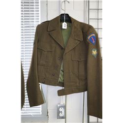 US Army military jacket complete with special forces patches including one for a campaign in Europe.