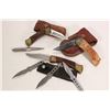 Image 1 : Three pocket knives, two with leather pouches, a set of three throwing knives and a metal spike.