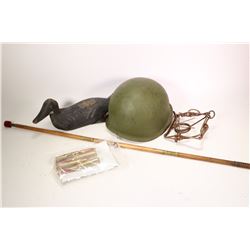 Selection of interesting collectibles including WWII metal helmet with camo. cover, four .50 cal dum